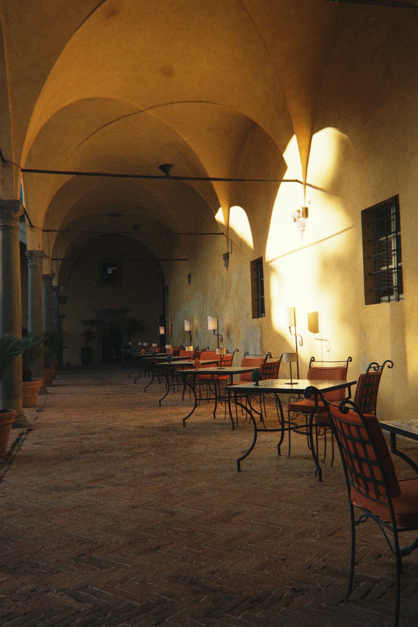 Golden light through the vaulted cloister at La Certosa di Maggiano.