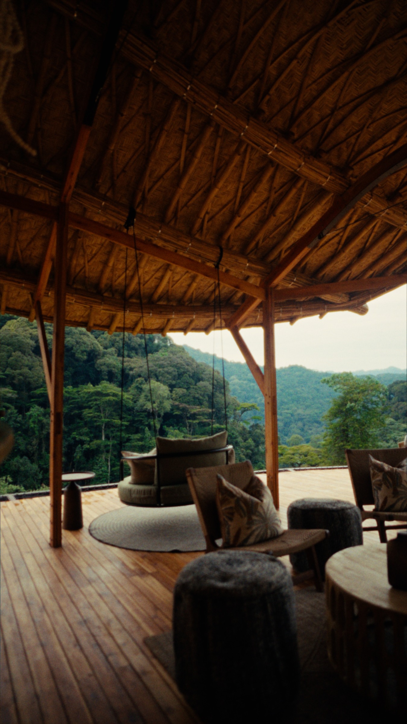 An open-air lounge with views into Bwindi’s forest.