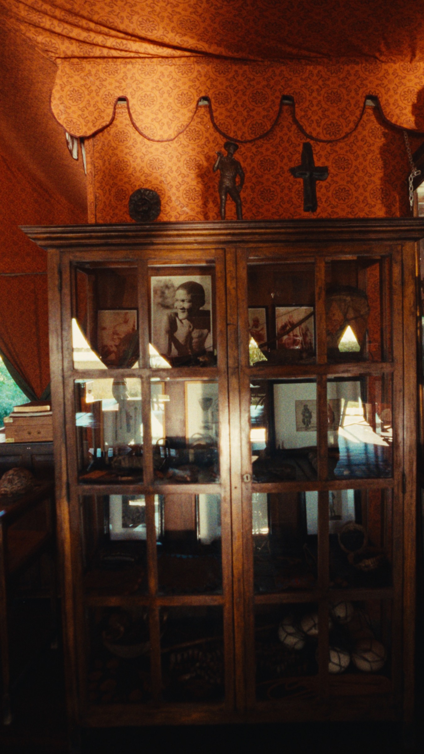 The cabinet of curiosities in Jack’s Camp’s rich tent interior.
