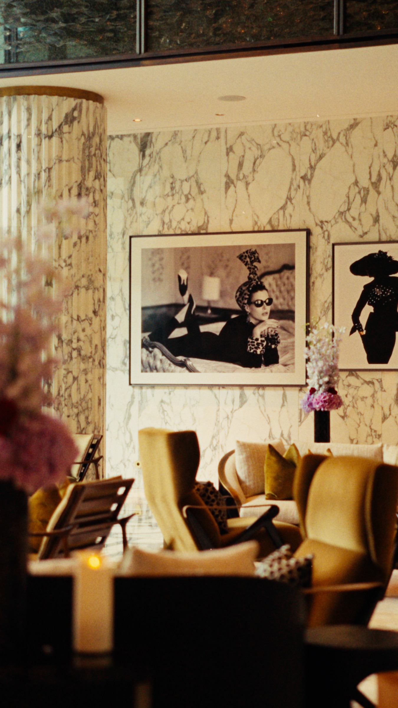 Marble, photographs and warm ochre seating at Royal Mansour.