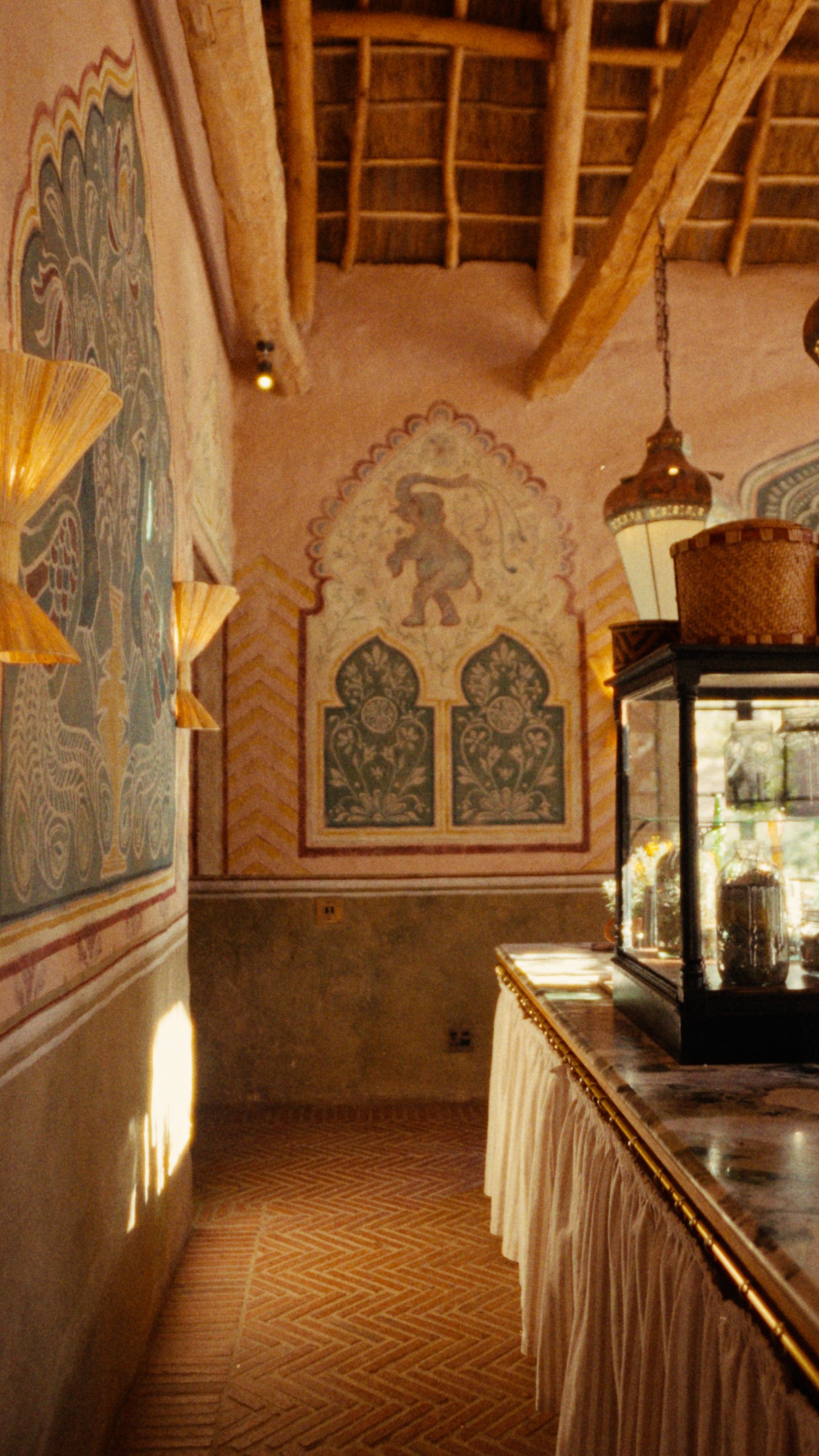 Painted walls and warm timber in the kitchen at Sterrekopje.