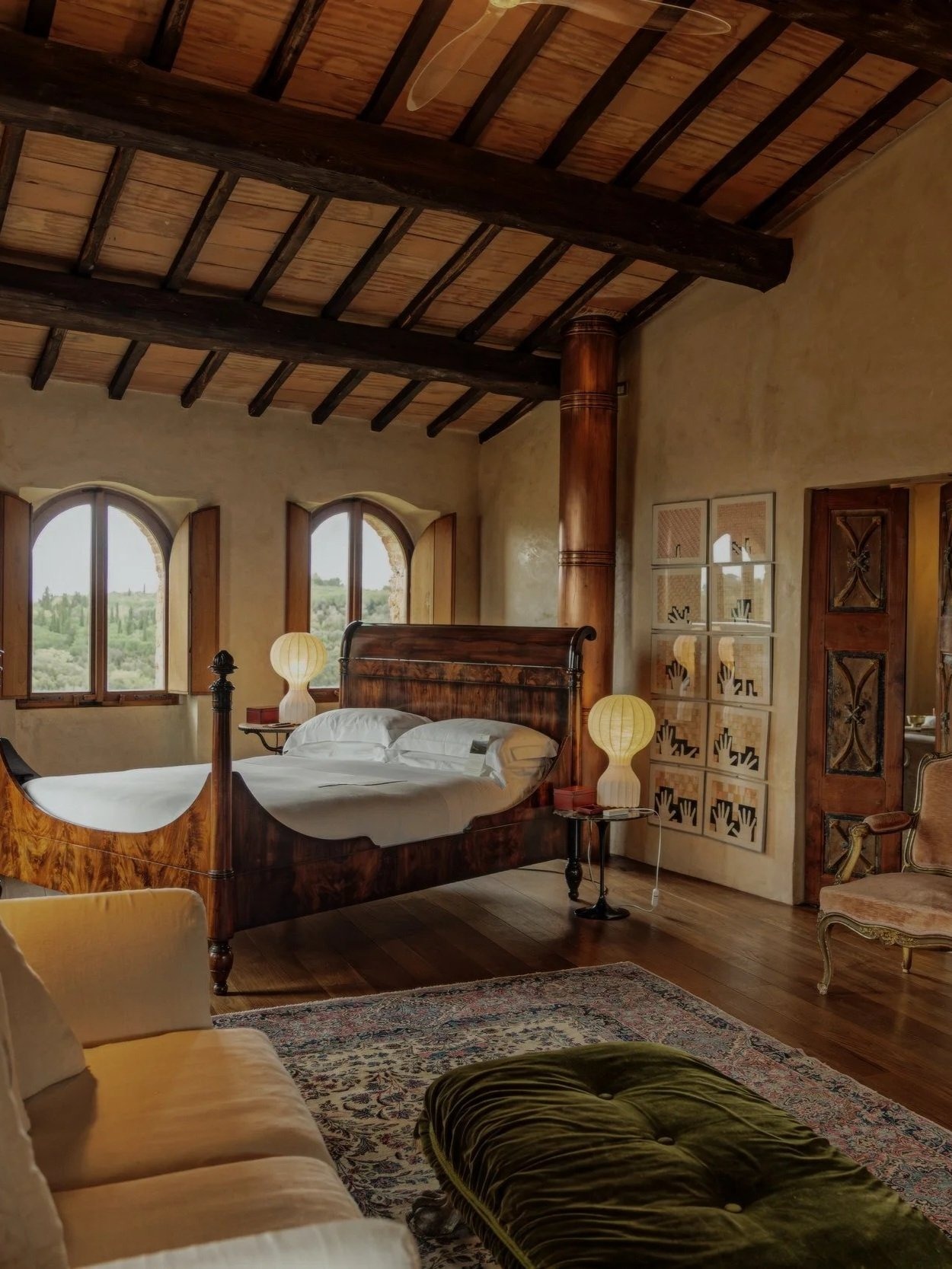 Timber beams, arched windows and a quiet bedroom.