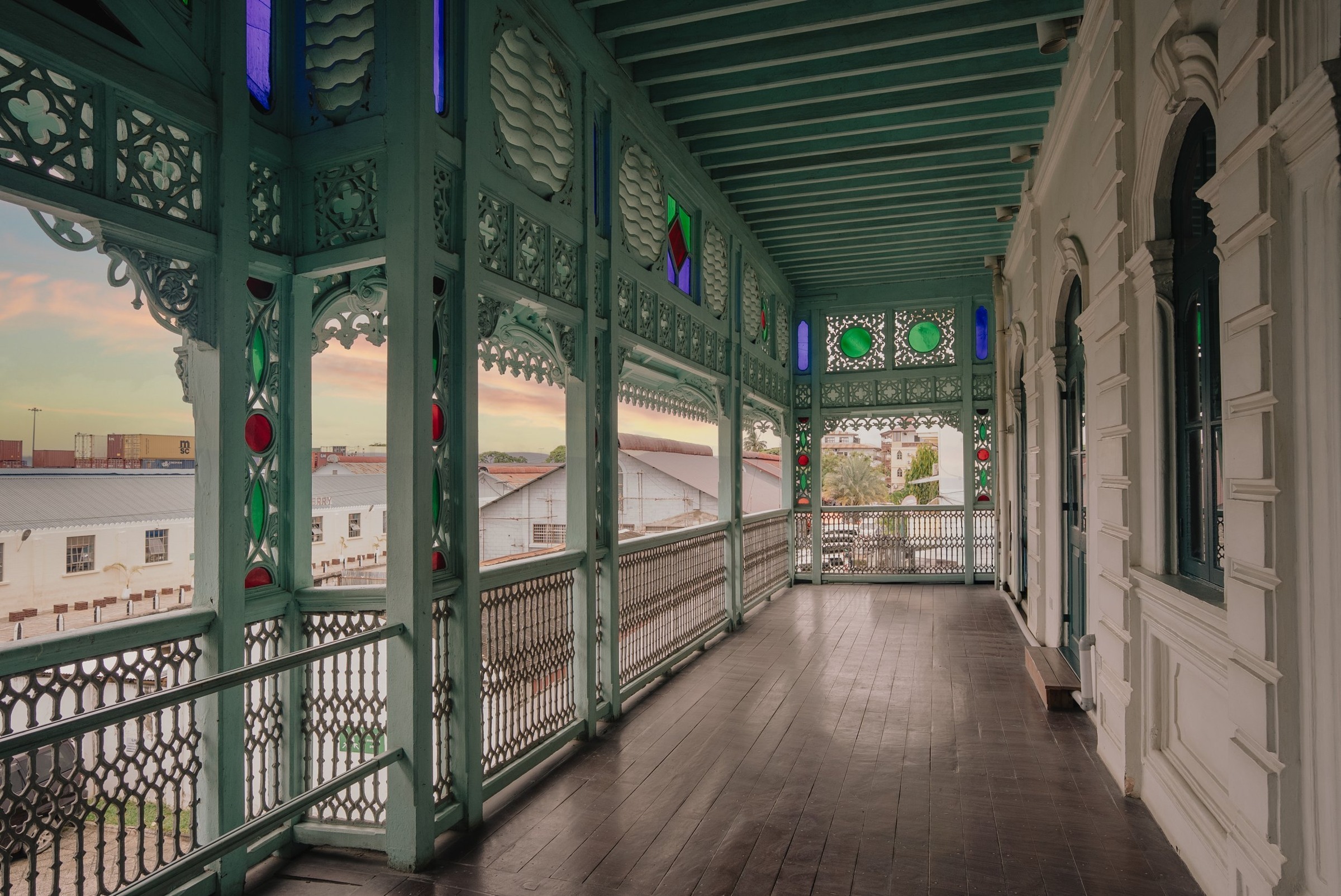 The carved balcony and coloured glass of Stone Town.