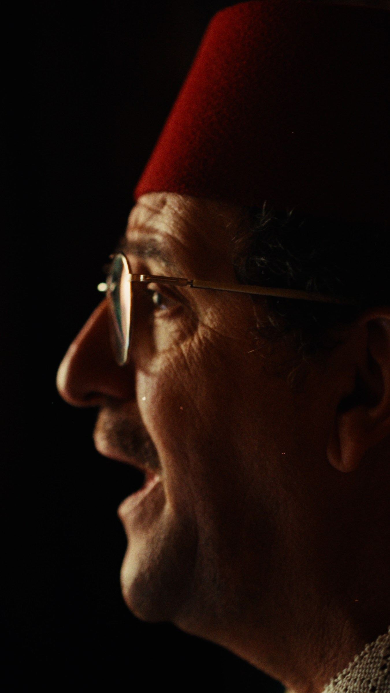 A close portrait of the musician in his red fez at Royal Mansour.
