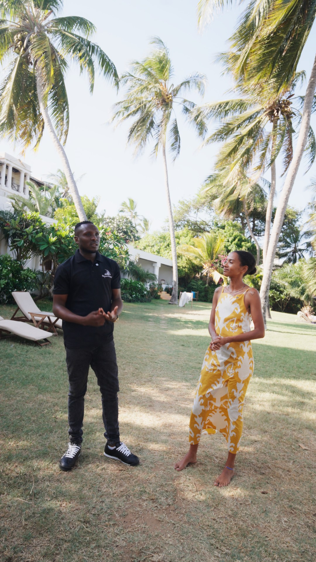 Yaye listening to a member of the Peponi team in the garden