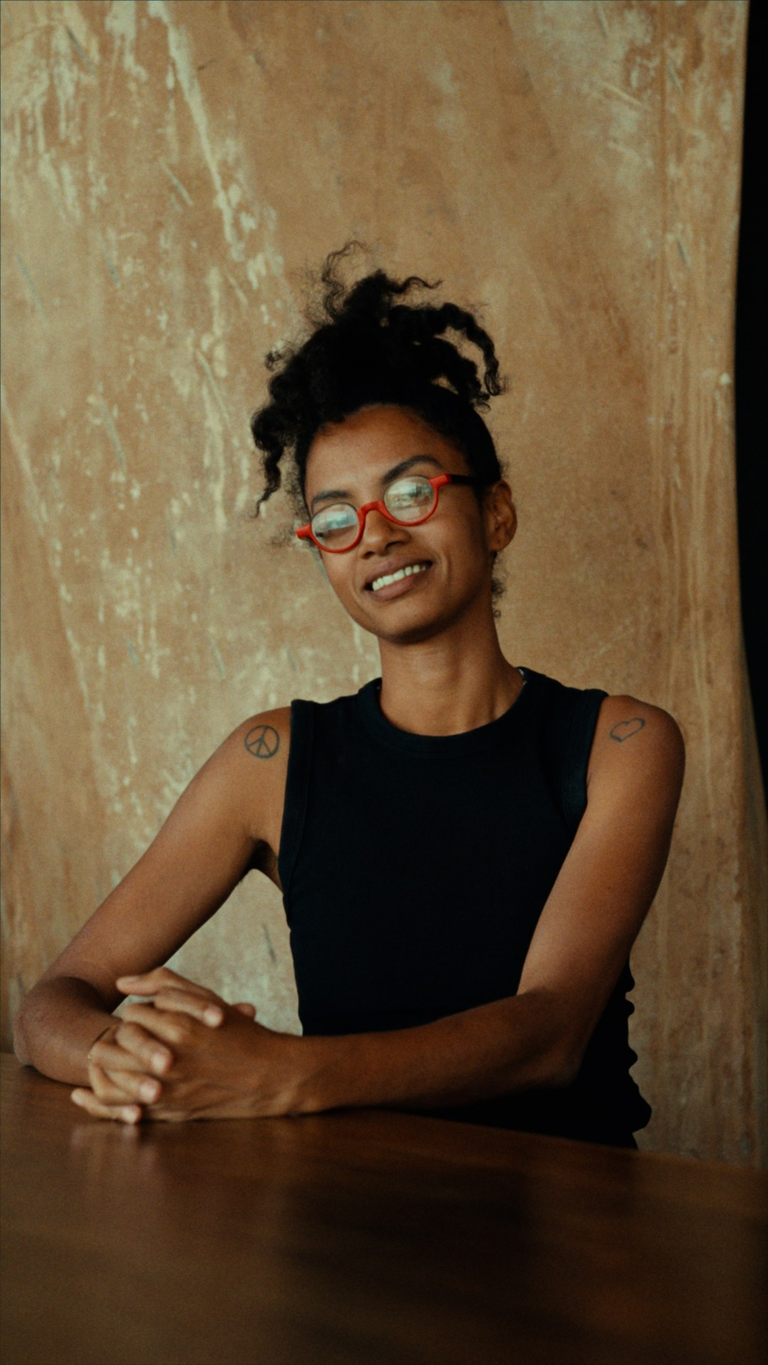 Yaye smiling in her red glasses
